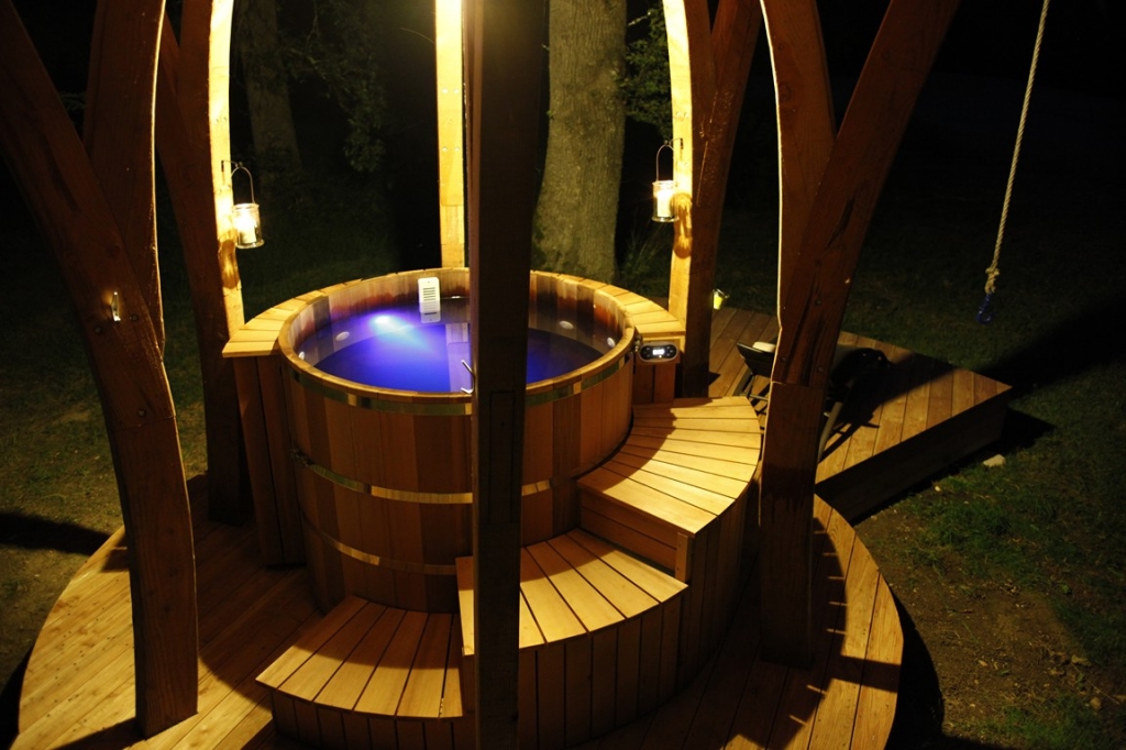 Wooden hot tub sant alone with skirting and winding stairs 